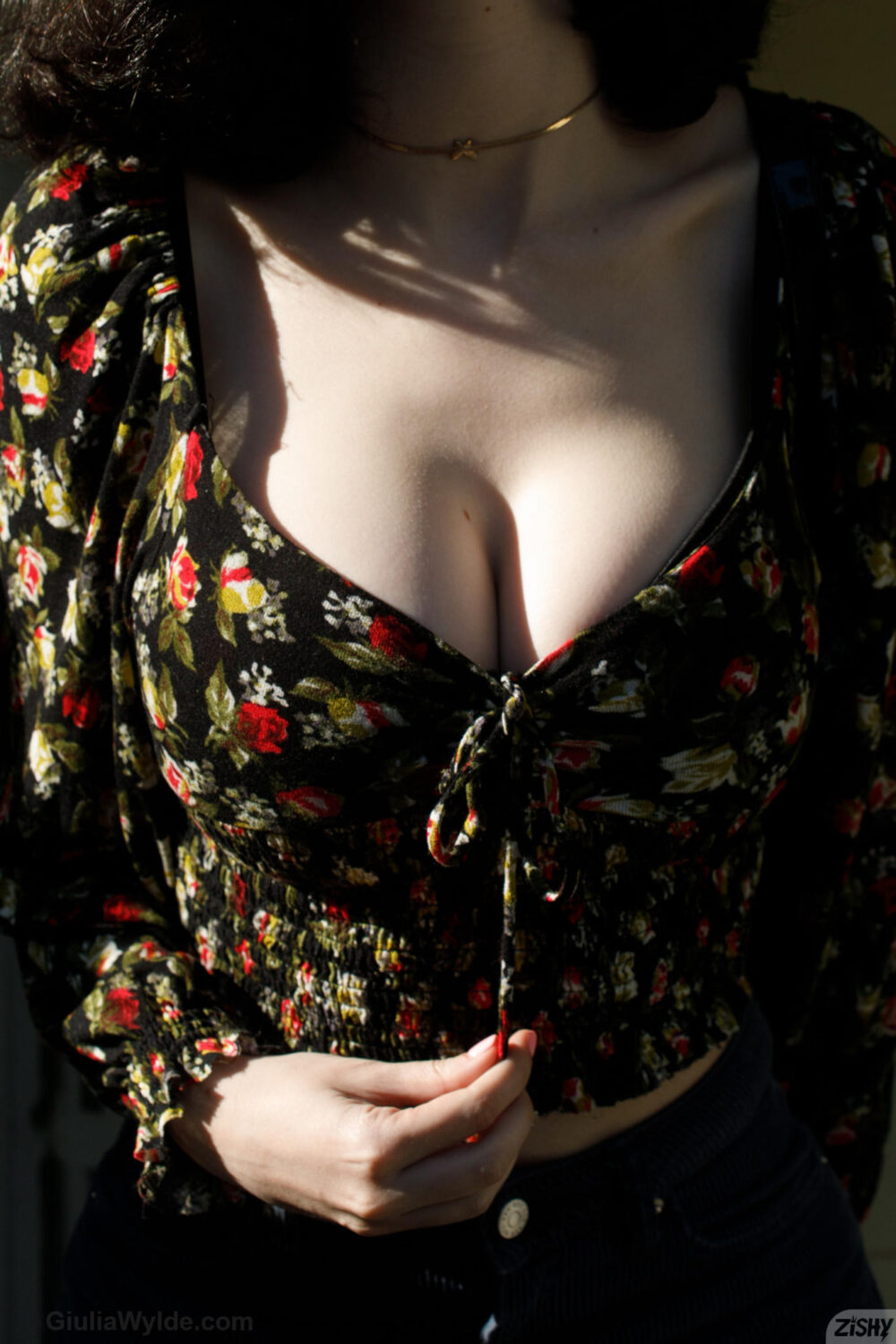 A dark top and pale cleavage... a dangerous contrast